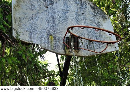 Very Old Abandoned Basketball Hoop That Is Falling Apart