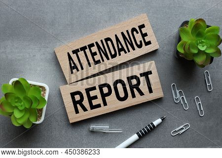 Attendance Report. Text On Wooden Blocks On Gray Background