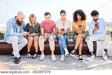 Group Of Serious People Addicted Technology. Friends Using Phone Dependency Social Media And Technol