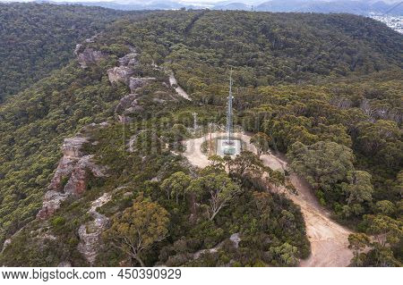 Drone Aerial Photograph Of A Large Telecommunications Tower In A Forest In The Central Tablelands Of