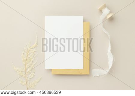 Blank Greeting Card Invitation Mockup 5x7 On Brown Envelope With Dried Flowers On Beige Background, 