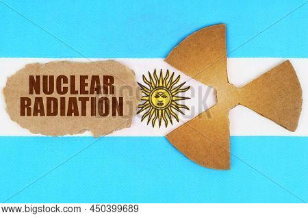 The Concept Of Industry And Radiation. On The Flag Of Argentina, The Symbol Of Radioactivity And Tor