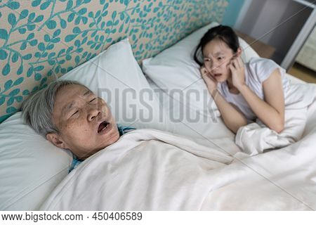 Asian Senior Woman Snoring Loudly,open Mouth,comfortably Sleeping,danger Of Obstructive Sleep Apnea 