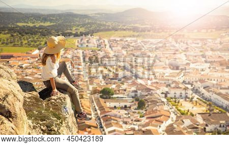 woman enjoying panoramic view of Spain city- Burguillos del Cerro