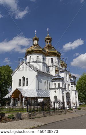 Beautiful  White Church With Golden Domes. Orthodox Church Of Saint Nicholas In  Busk City, Outdoors