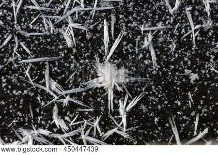Ice Crystals Forming On Surface Of Frozen Pond