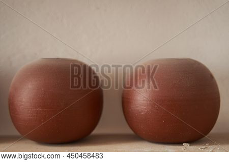 Handmade Unglazed Earthenware Pieces In Potter Workshop