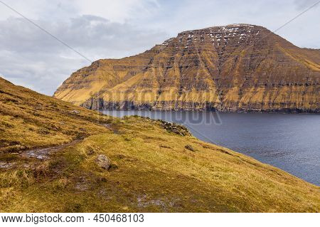 Steep Coast Of The Island Of Bordoy. Volcanic Archipelago In The Atlantic Ocean, Muli, Faroe Islands