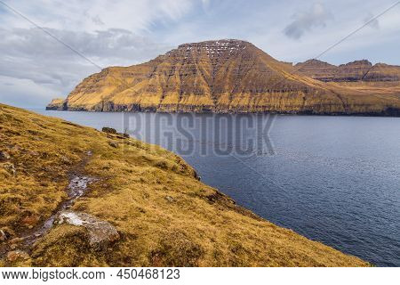 Steep Coast Of The Island Of Bordoy. Volcanic Archipelago In The Atlantic Ocean, Muli, Faroe Islands