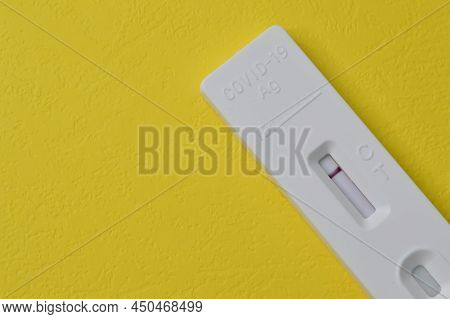 Covid-19 Antigen Rapid Test Isolated On A Yellow Background.