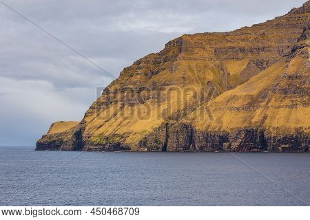 Steep Coast Of The Island Of Bordoy. Volcanic Archipelago In The Atlantic Ocean, Muli, Faroe Islands