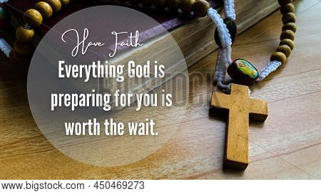 Holy Bible And Holy Rosary On Wooden Desk With Text Everything God Is Preparing For You Is Worth The