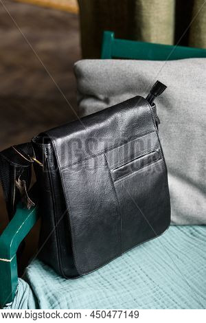 Close-up Photo Of Black Messanger Leather Bag On A Chair