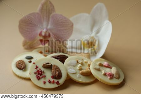 Milk Chocolate Mendiants With Orchids On The Table