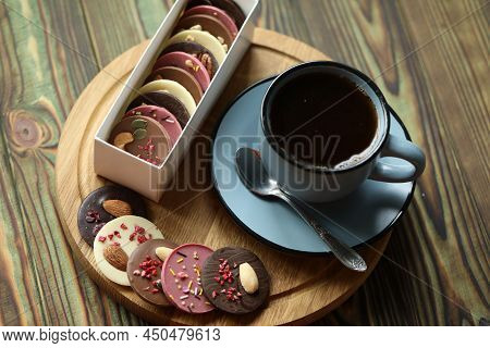 Cup Of Coffee With Chocolate On Wooden Table