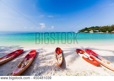 Sea Kayaks On The Sand Beach On Sunny Summer. Luxury Resort In The Background. Koh Talu Island, Thai