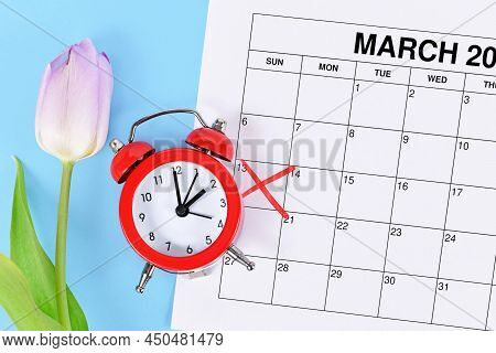 Concept For Time Change For Daylight Saving Time In The United States On March 13th With Red Alarm C