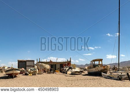Cabo De Gata, Spain - September 04, 2020: Fishing Boats And Ships Stranded On The Beach Sand In The 