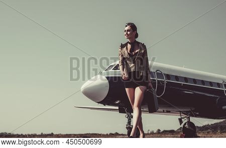 Airport And Charming Stewardess On Blue Airplane Background. Portrait Of Charming Stewardess Wearing