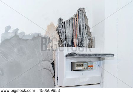 Installation Of Electrical Distributor In The Apartment. Voltage Fuses In A Gray Box Against A White