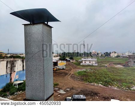 Stock Photo Of Metal Chimney Pipe On The Rooftop Of The House , Residencial Area On Background. Pict
