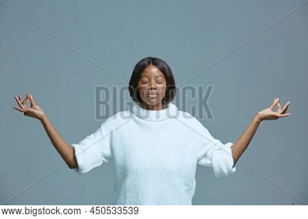 Peaceful Calm Young African American Woman Meditate, Breathing, Do Mudra Gesture, Closed Eyes. Stres