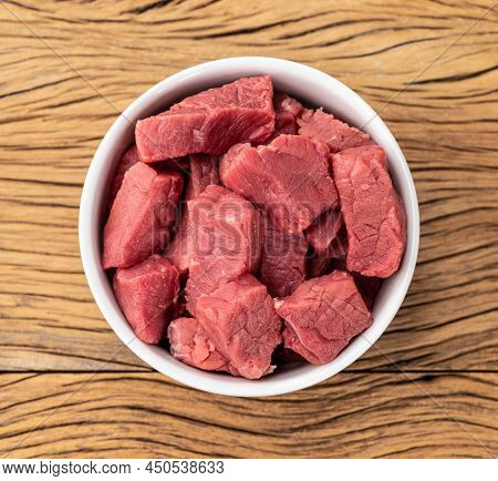 Chopped Topside Meat In A Bowl Over Wooden Table.