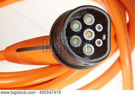 A Colored Charging Cable For Electric Cars Against A White Background.