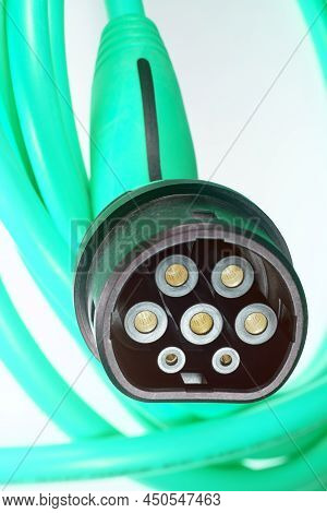 A Colored Charging Cable For Electric Cars Against A White Background.