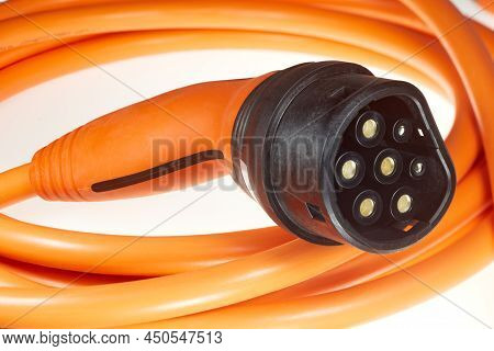 A Colored Charging Cable For Electric Cars Against A White Background.