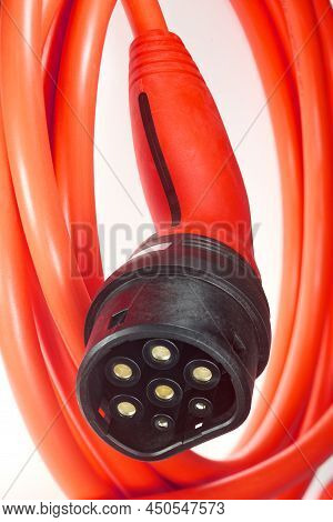 A Colored Charging Cable For Electric Cars Against A White Background.