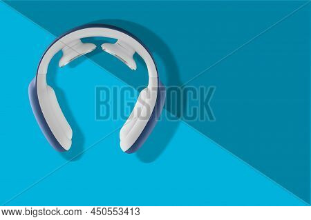 Compact Pulse Electric Smart Neck Massager On Blue Background. Acupressure Massage Posible With Comp