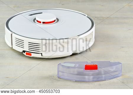 Robot Vacuum Cleaner Water Tank Removed. Smart Cleaning And Washing Technology. Advanced Robot Work 