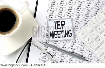 Iep Meeting Text On A Sticky On The Chart With Coffee,pen And Calculator