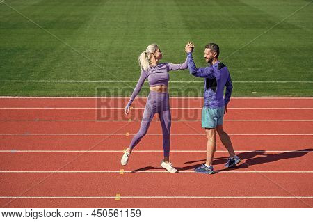 Sport Couple Celebrate Team Win. Fitness Partners. Athletic Man And Sexy Woman Compete In Armwrestli