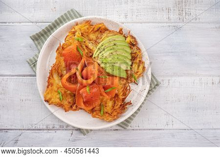 Fried Potato Pancakes With Salmon And Sour Cream, Fritter, Roesti, Golden Crispy Crust. Traditional 