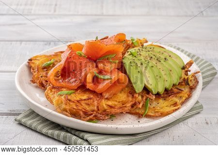 Fried Potato Pancakes With Salmon And Sour Cream, Fritter, Roesti, Golden Crispy Crust. Traditional 