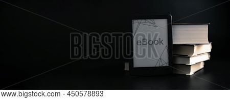 E Reader. Digital E Book, Library Reader Tablet With Books On Dark Background. Online Education Cour