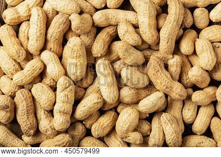 Close Up Peanuts Or Groundnuts Pattern. Peanuts In The Shell