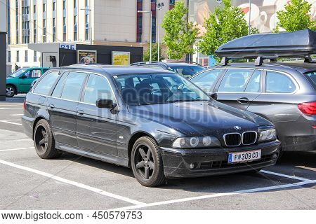 Schwechat, Austria - July 24, 2014: Black Estate Car Bmw 5-series (e39) In A City Street.