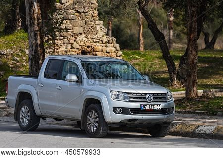 Side; Turkey - February 18 2022:  Silver  Volkswagen Amarok      Is Parked  On The Street On A Warm 
