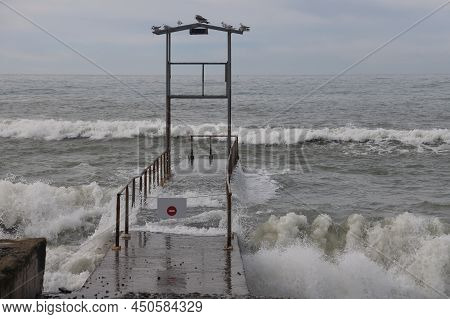Sochi, Russia 05.07.2021. Breakwater Pier Summer Black Sea Cloudy.