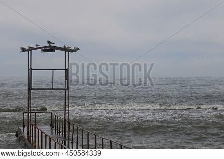 Sochi, Russia 05.07.2021. Breakwater Pier Summer Black Sea Cloudy.