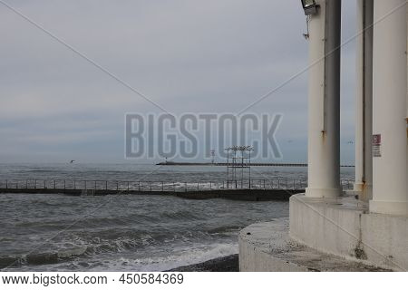 Sochi, Russia 05.07.2021. Breakwater Pier Summer Black Sea Cloudy.
