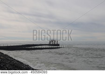 Sochi, Russia 05.07.2021. Breakwater Pier Summer Black Sea Cloudy.