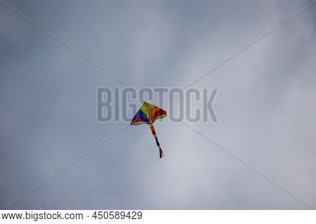 A Colorful Stunt Kite, Kite With Colorful Tail In The Sky.