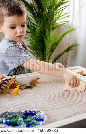 Focused Baby Boy Confidently Playing Early Development Game Kinetic Sand Montessori Material