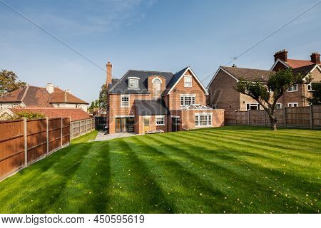 Saffron Walden, Essex - October 16 2017: Rear Elevation And Lawn Of Renovated Brick Built Traditiona