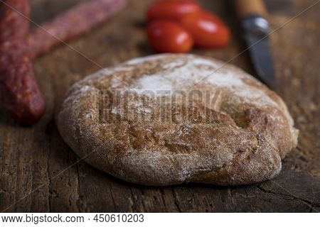 Bread From South Tyrol On Wood With Sausages