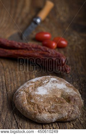 Bread From South Tyrol On Wood With Sausages